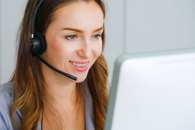 Beyond Solutions – contact centre staff member listening to customer